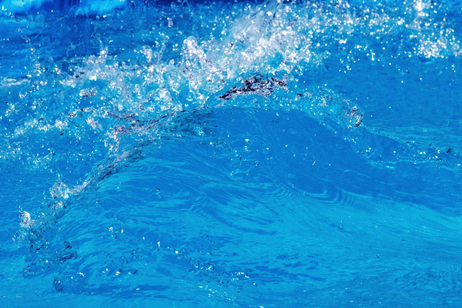 a person riding a surfboard on a wave in the ocean
